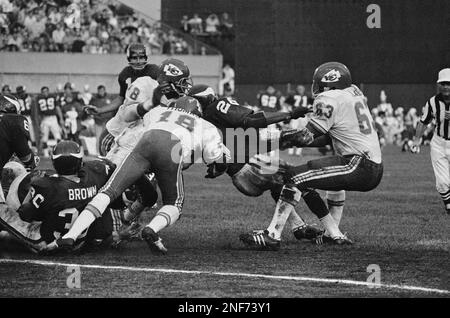 FILE - In this Oct. 19, 1971, file photo, Pittsburgh Steelers' John Fuqua  (33) is brought down Kansas City Chiefs' Willie Lanier after a 3-yard game  during an NFL football game in