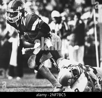 New York Jets Freeman McNeil gives a straight arm to Wilber Marshall as he  goes for a short gain in second quarter at East Rutherford on Saturday,  Dec. 14, 1985. In back