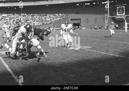 Ray McDonald of the Washington Redskins hurdles over Freeman White of the New  York Giants and Clarence Childs of the Giants give him a shove in the  fourth quarter on Oct. 1, 1967 at Washington. The play netted the Skins a  couple of yards. Washington