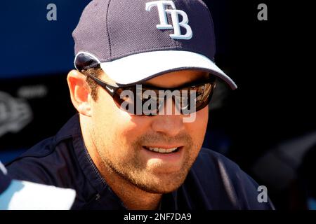 Tampa Bay Rays left fielder Pat Burrell waves to the fans after a special  video presentation on the big screen to honor him as a former Phillies'  player before the Rays' preseason