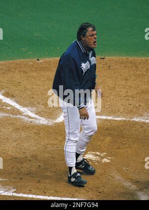Manager Lou Piniella of the Seattle Mariners yells at home plate umpire  Dale Scott after covering home plate with dirt following his ejection from  game against the Kansas City Royals during the
