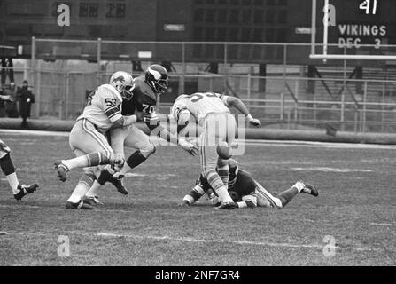 FILE ** Minnesota Vikings' Jim Marshall (70) clutches the game ball as he  is carried off the field by teammates Doug Southerland, left, and Scott  Studwell after the Vikings beat the