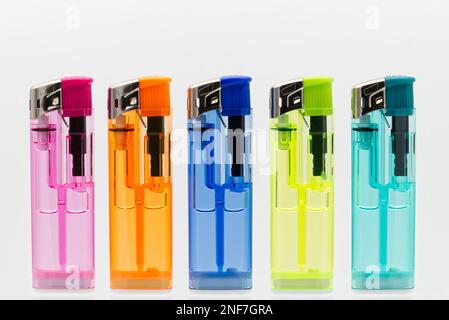 Set of transparent lighters isolated on white background. Stock Photo