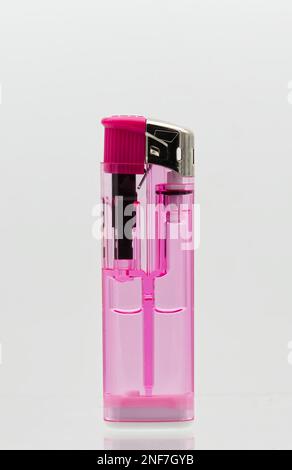 Pink transparent lighter isolated on white background. Stock Photo