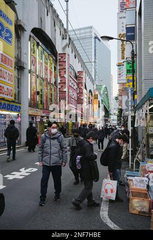 Crowds wandering through a backstreet in Akihabara in Tokyo, Japan. Stock Photo