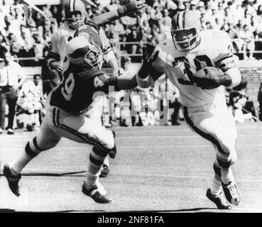 Rookie Ron Johnson (30) Cleveland Browns back, steps away from one hand  tackle by Dave Lloyd (52) Philadelphia Eagles Linebacker, as Johnson made  three-yard gain in the second period of an Eagles-Browns