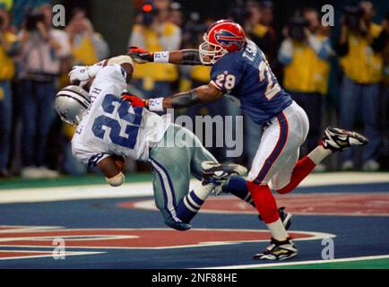 Dallas Cowboys running back and Super Bowl MVP Emmitt Smith waves from a  truck during the Cowboys Super Bowl Victory Parade, Friday, Feb. 18, 1994  in Dallas. With Smith is teammate Alfredo