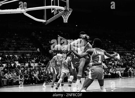 New York Nets Jan van Breda Kolff leans on Buffalo Braves John