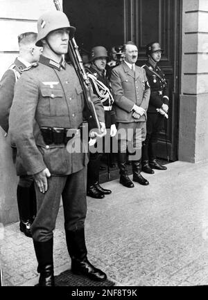 German leader Adolf Hitler stands in his convertible. Reproduction of ...