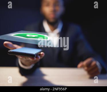 Phone, hologram and business hands with lock icon for cybersecurity, software safety or digital data protection. Augmented reality of futuristic black Stock Photo