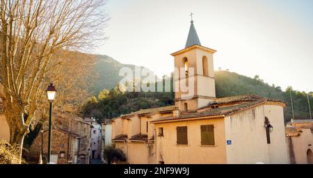 View of the church of Saint Christophe in the small town of Mazaugues in the Var department, located at the eastern end of the Sainte-Baume massif, in Stock Photo