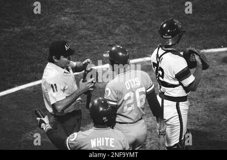 Home plate umpire Don Denkinger (11) keeps Toronto Blue Jays manager Cito  Gaston in place as Tim Tschida, middle, steers fellow umpire Jim Joyce away  following a bench clearing brawl with the