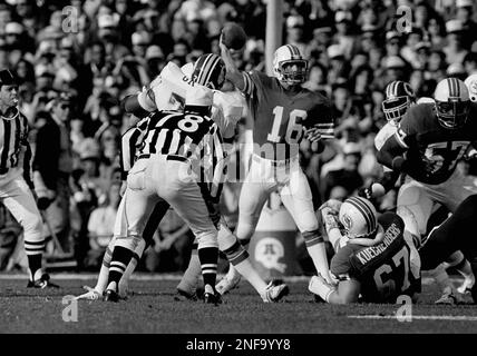 Miami Dolphins quarterback David Woodley (16) gets smacked by Washington  Redskins rusher Dexter Manley (72) during first quarter of Super Bowl XVII  at the Rose Bowl in Pasadena, Jan. 30, 1983. Woodley