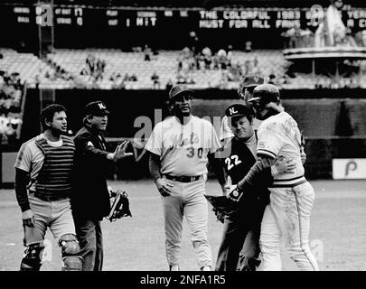 Umps Satch Davidson (4) and Joe West (22) tell Atlanta Braves Bob Horner,  right, to cool it as he and New York Mets catcher Ron Hodges (42) exchange  words after Horner knocked him down while trying to score in the 8th inning  of their game at Atlanta