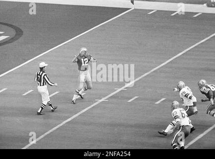 Quarterback John Brodie of the San Francisco 49ers gets dumped in his  backfield as Baltimore Colts' defensive back Jerry Logan (20) and  linebacker Dennis Gaubatz (53) blitzed on the play, at Baltimore