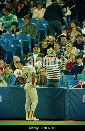 Toronto Blue Jays Rickey Henderson hit a home run off Oakland Athletics  pitcher Ron Darling as A's catcher Scott Hemond watches the play in the  fifth inning at Oakland, Aug. 30, 1993.