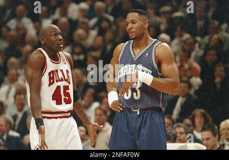 Chicago Bulls' Michael Jordan, left and Luc Longley, right, squeeze out  Charlotte Hornets' Alonzo Mourning during the third quarter of the Bulls'  103-80 win on Tuesday, May 2, 1995, in Chicago. The