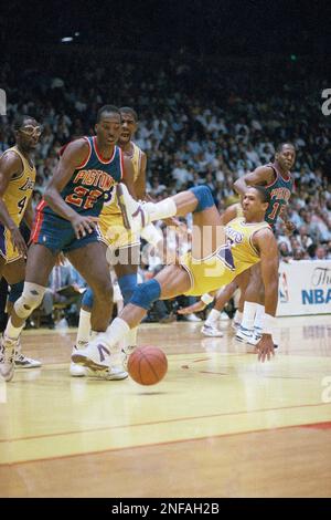 Los Angeles Lakers' Mychal Thompson falls to the court as teammate Magic  Johnson screams his displeasure at the Forum in Inglewood, June 9, 1988,  and Detroit's John Salley moves in to take