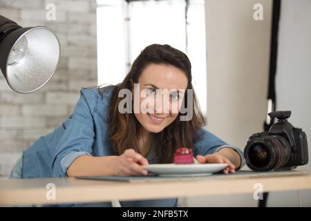 woman vlogger baking and recording video for food channel Stock Photo