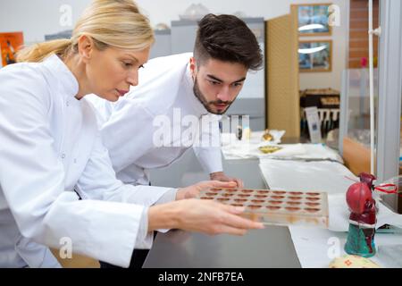 portrait of chocolate factory workers Stock Photo