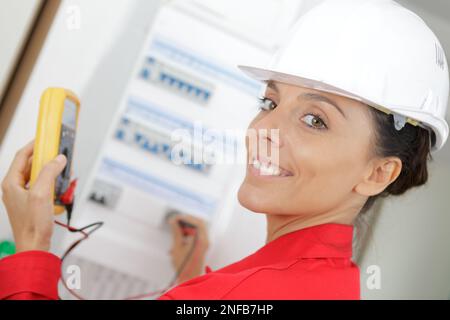 portrait of female electrician using multimeter Stock Photo
