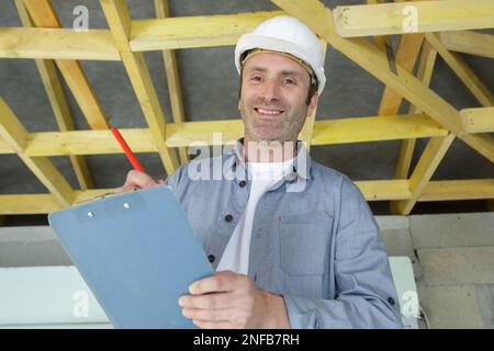 happy man construction worker smiling while holdin Stock Photo