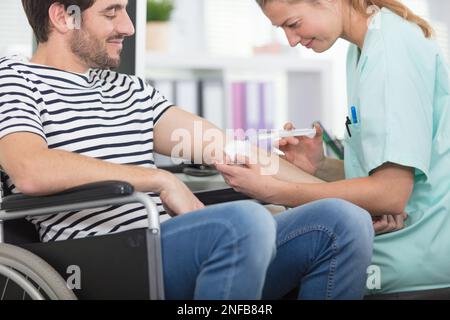 young male patient in blood transfusion concept Stock Photo