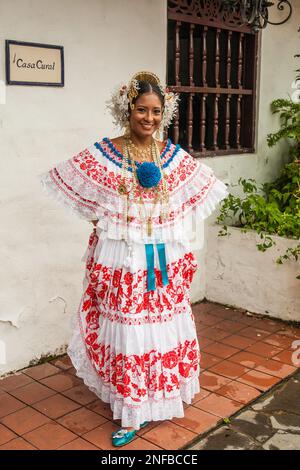 Panamanian woman in a colorful traditional pollera, the national dress of  Panama. Along with the beautiful hand-embroidered dress, gold jewelry and i  Stock Photo - Alamy