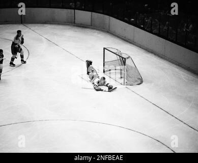 https://l450v.alamy.com/450v/2nfbeae/new-york-rangers-goalie-lorne-worsley-lies-flat-on-the-ice-as-he-peers-into-the-net-at-puck-after-it-was-pushed-in-by-gus-bodnar-for-a-chicago-black-hawks-score-in-final-period-of-nhl-game-at-madison-square-garden-in-new-york-city-nov-12-1952-four-other-goals-by-wally-hergesheimer-enabled-the-rangers-to-beat-black-hawks-5-2-ap-photojohn-lent-2nfbeae.jpg