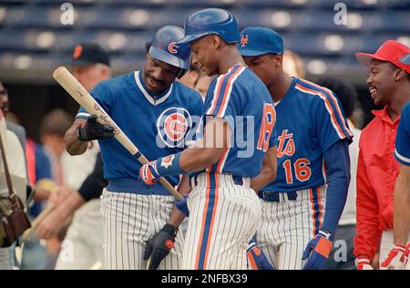 New York Mets starter Dwight “Doc” Gooden wears a jersey with the number  “00” while holding another with his current number “16” in the Mets  clubhouse in Port St. Lucie, Saturday, Feb.