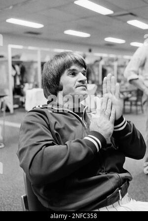 Philadelphia Phillies first baseman Pete Rose looks over a children's book  by teammate Tug McGraw as he sits in the club's locker room at Jack Russell  Stadium in Clearwater, Fla., March 10