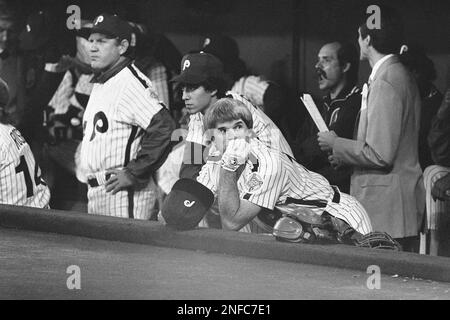 Philadelphia Phillies first baseman Pete Rose looks over a children's book  by teammate Tug McGraw as he sits in the club's locker room at Jack Russell  Stadium in Clearwater, Fla., March 10