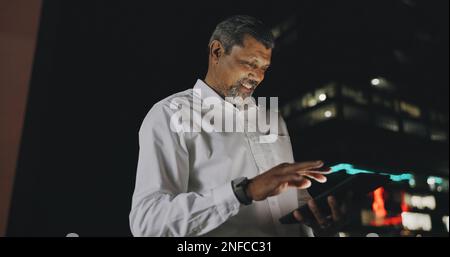 Success, celebration and black man with phone on city rooftop at night. Winner, wow and surprised businessman fist pump with 5g tablet in town Stock Photo