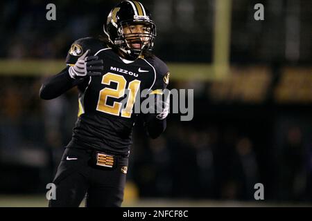 Missouri defensive back Castine Bridges (21) knocks the ball loose from Oklahoma  State wide receiver Dez Bryant (1) as Missouri defensive lineman Stryker  Sulak (38) looks on during the first quarter of