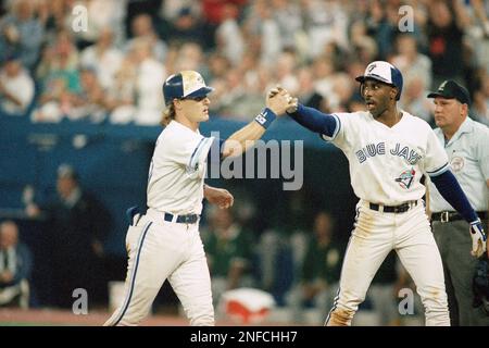 Toronto Blue Jays third baseman Kelly Gruber, right, congratulates relief  pitcher Tom Henke after Henke saved Game 4 of the World Series against the  Atlanta Braves at SkyDome in Toronto, Oct. 22