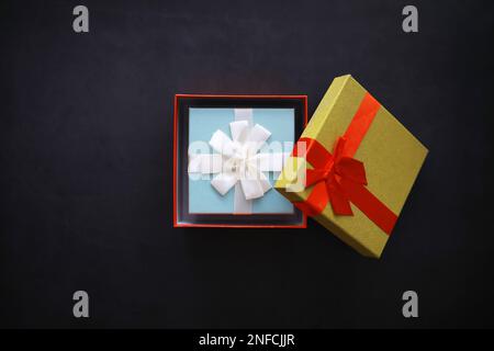 Christmas decoration. Gift boxes on black stone  background. Top view. Christmas greeting card concept. Stock Photo