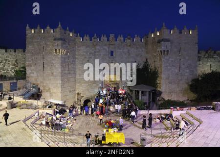 JERUSALEM, ISRAEL - OCTOBER 29, 2022: People visit Damascus Gate of Jerusalem Old City. It is part of Jerusalem's UNESCO World Heritage Site.