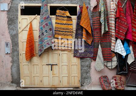 Moroccan carpet. Traditional wool carpets from a street vendor in a souk in Marrakech. Morocco handicraft. Stock Photo