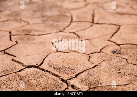 Dried mud ground - dry riverbed background. Drought in Morocco. Stock Photo