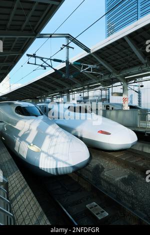 Two bullet trains (shinkansen) parked at Tokyo Station in Tokyo, Japan Stock Photo