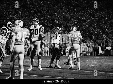 Atlanta Falcons quarterback Steve Bartkowski (10) goes down and loses the  ball as Los Angeles Rams linebacker Joe Harris sacks Bartkowski during the  overtime period in Anaheim, Dec. 21, 1980. The Rams