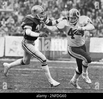 Washington Redskins full back John Riggins (44) runs over