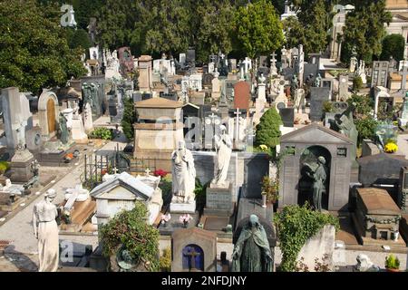 MILAN, ITALY - OCTOBER 6, 2010: Cimitero Monumentale in Milan, Italy. The Monumental Cemetery designed by the architect Carlo Maciachini is famous for Stock Photo