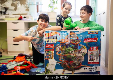 Ternopil, Ukraine - February, 2023: Boy Unboxing Hot Wheels City