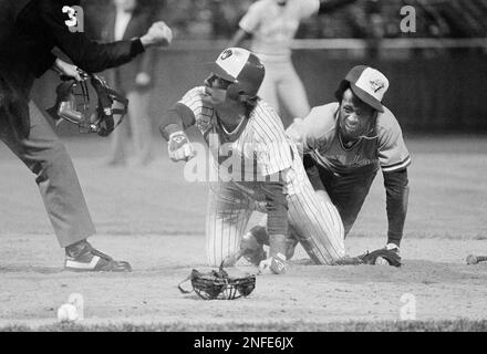 Milwaukee Brewers Paul Molitor, left, Jim Slaton, center, and Jim Gantner  embrace on the mound after their 9-5 win over the California Angels tied  the American League playoff series at two games