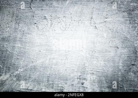 Grey old wall background - detailed grunge texture with dark edges. Stock Photo