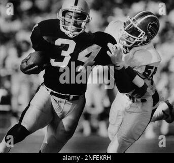 Buffalo Bills linebacker Cornelius Bennett, right, helps Houston Oilers  quarterback Warren Moon to his feet after sacking him in the third quarter  of their AFC playoff game at Rich Stadium in Orchard