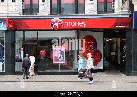 LEEDS, UK - JULY 12, 2016: People visit Virgin Money branch in Leeds, UK. The banking and mortgage financial specialist Virgin Money is part of Virgin Stock Photo