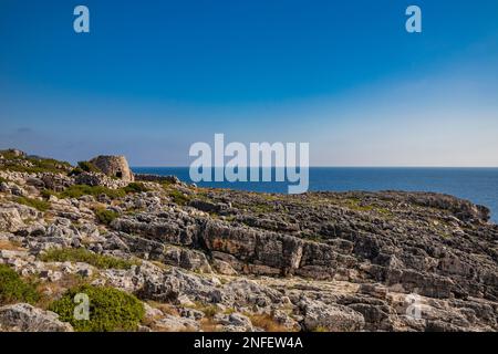 Gagliano del Capo. The beautiful panorama on the blue sea, from the rocky cliff of Salento. An old stone trullo. The nature trail that leads from the Stock Photo