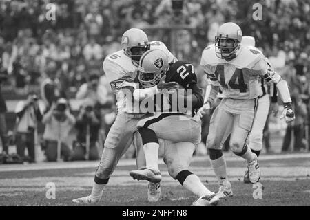 Los Angeles Raiders' veteran running back Frank Hawkins (27) heads